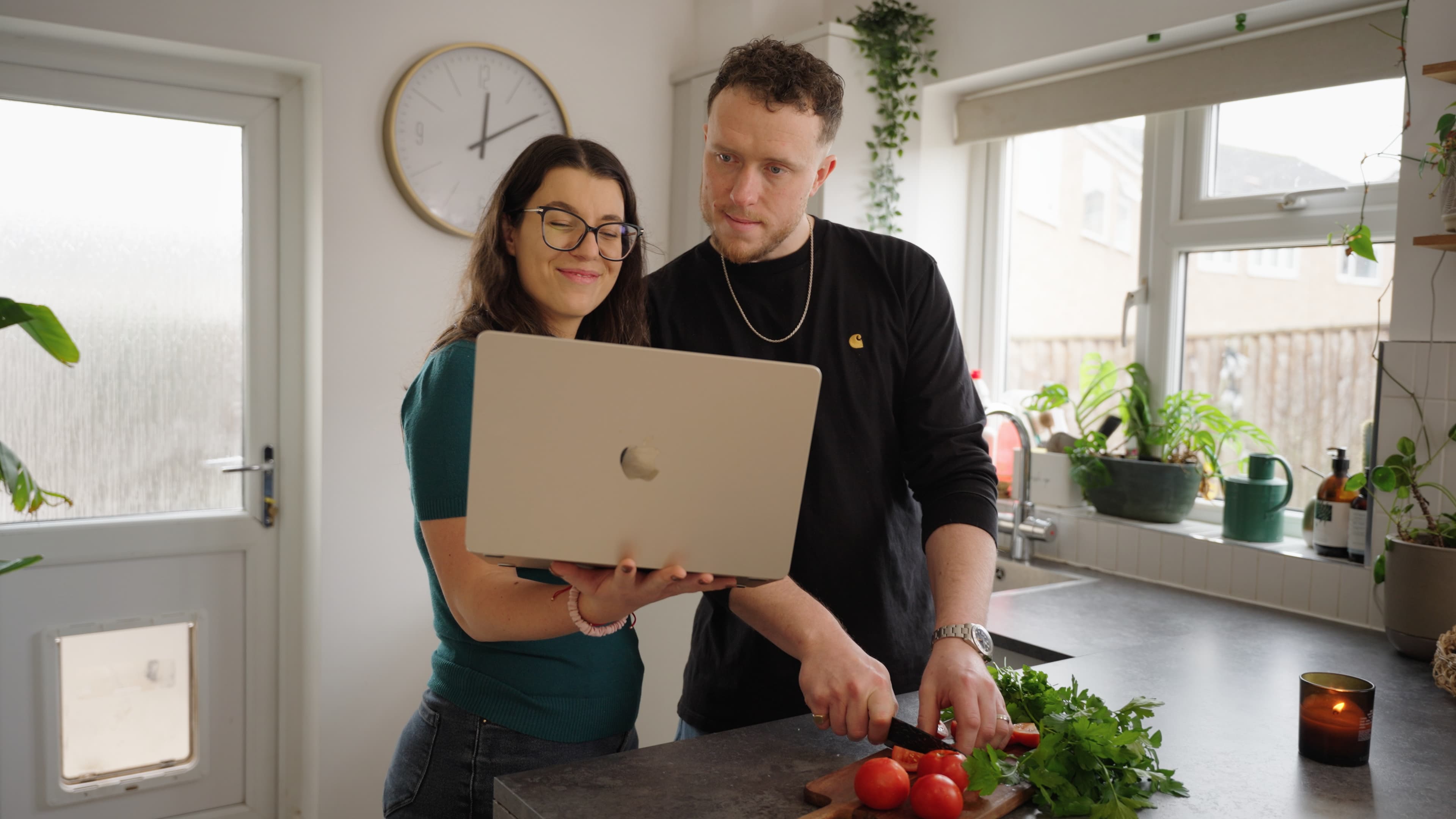 A couple reviewing their fostering assessment progress together at home