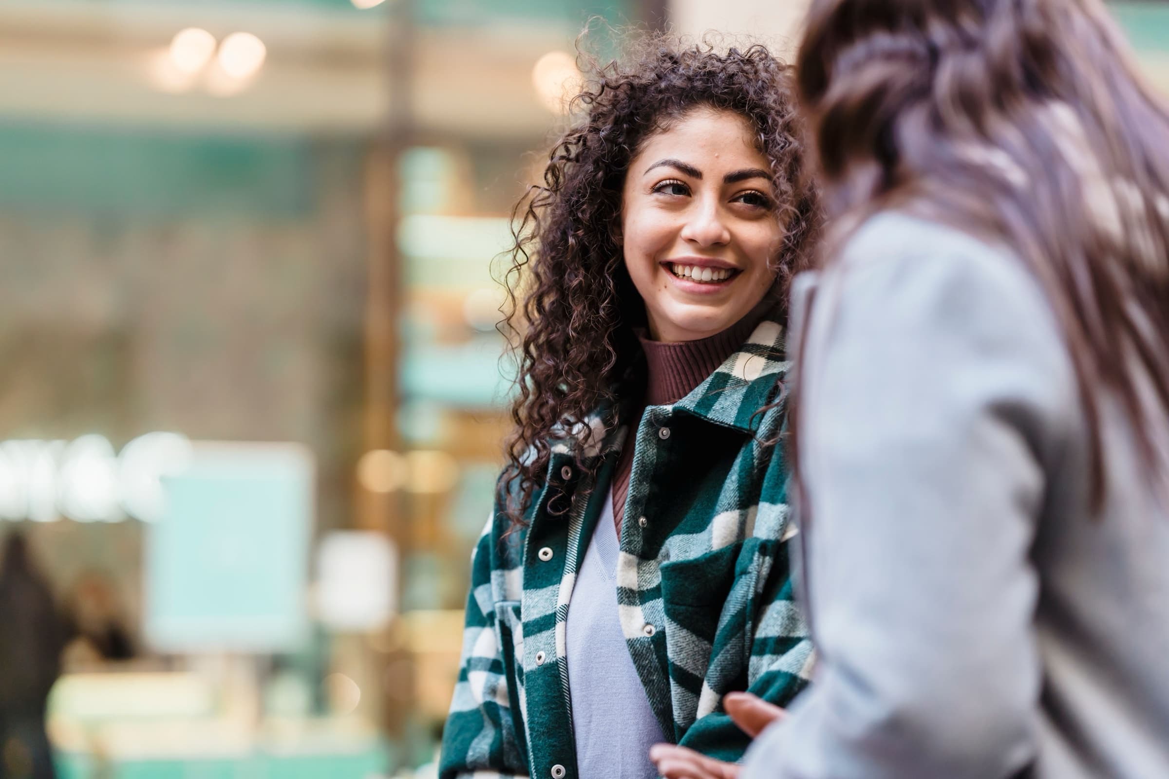 Two colleagues in conversation outside a fostering agency office